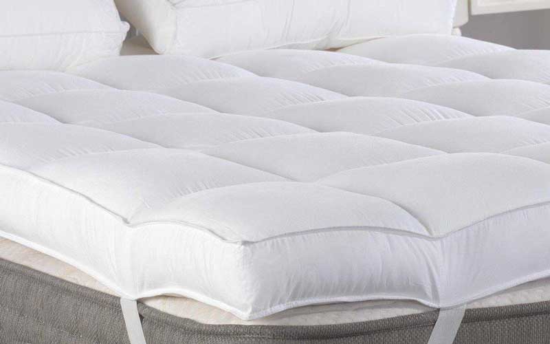 How can I make my guest bed more comfortable?