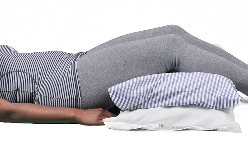 Back sleeper with a pillow under the knees